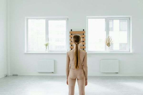 An empty, minimalist studio space with natural light, ready for practice.